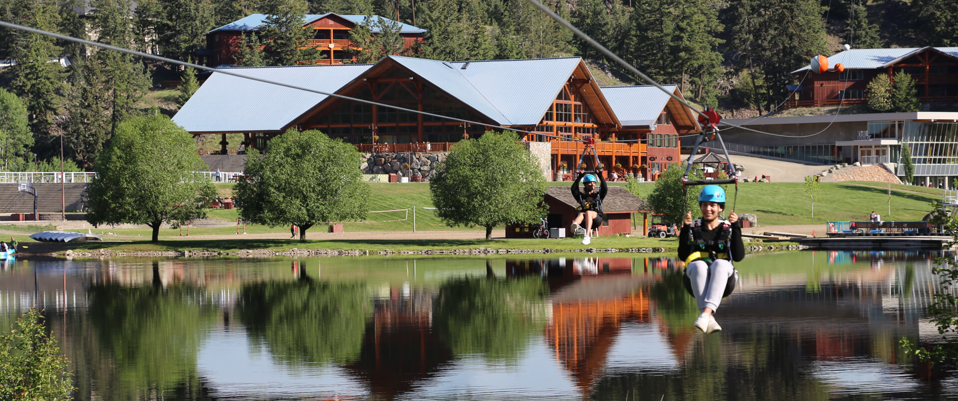 Zip line over lake at RockRidge Canyon Retreat Centre