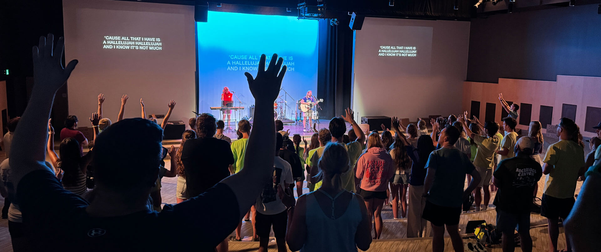 Staff and volunteers worship in The Rock - Faith and Community - at RockRidge Canyon camp and Retreat Centre