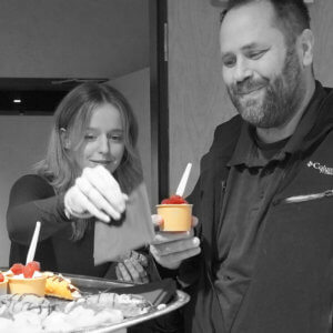 Office Manager Jason G enjoys raspberry mouse with daughter in The Rock Foyer at RockRidge Canyon Retreat Centre