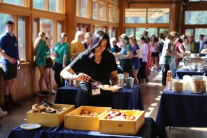 Women enjoying buffet breakfast in the light filled Pinnacle dining room, RockRidge Canyon Retreat Centre, Princeton BC