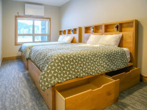 Ashnola Custom designed Beds built to store luggage + retreat guest bags neatly